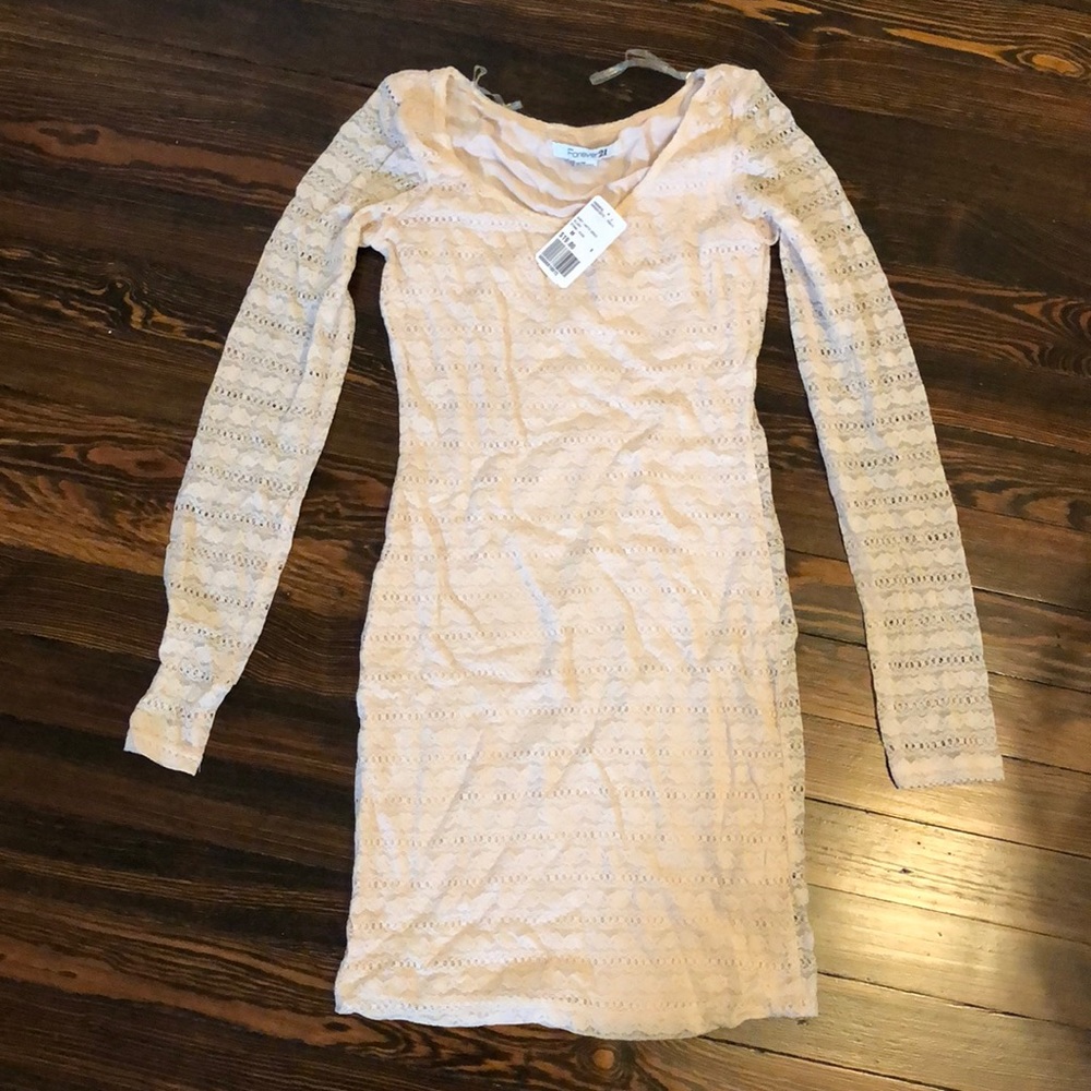 Women’s fitted dress. Lands above knee. Size M